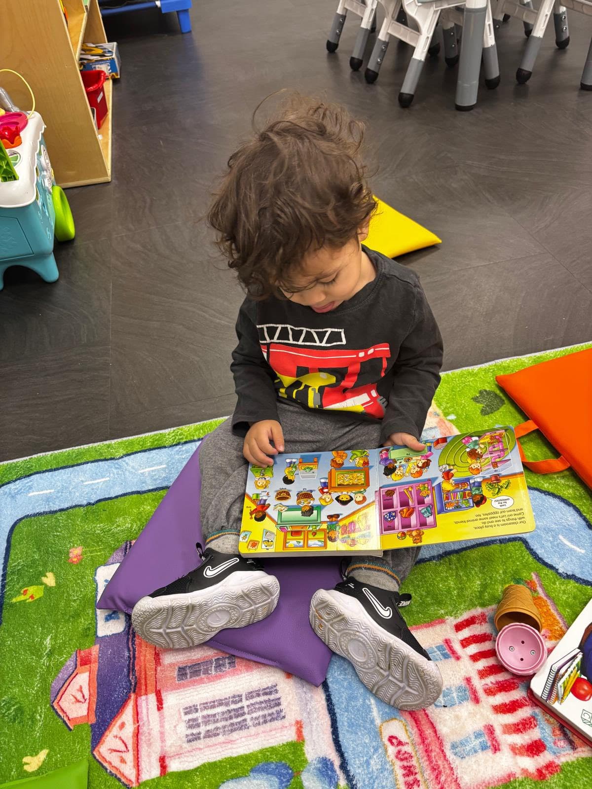 Child engaged in a calm daycare learning activity at Boss Babies